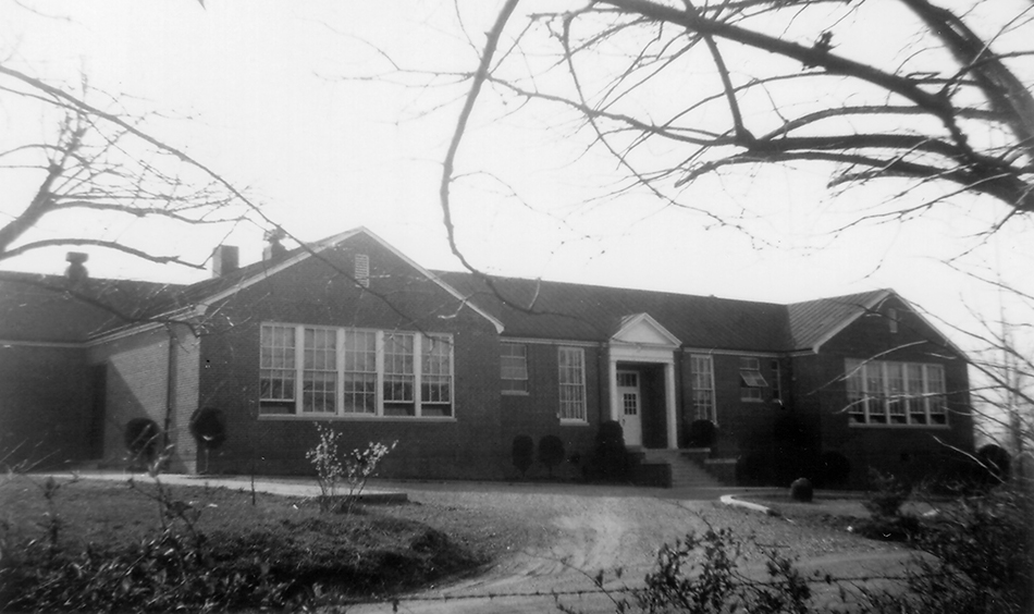Black and white photograph of the front of Louise Archer Elementary School.