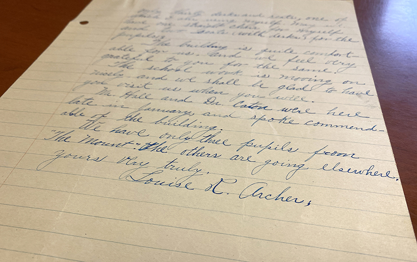 Photograph of a handwritten document bearing Louise Archer’s signature.